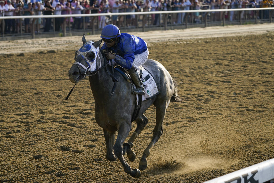 Essential Quality (2), with jockey Luis Saez up, crosses the finish line to win the 153rd running of the Belmont Stakes horse race, Saturday, June 5, 2021, at Belmont Park in Elmont, N.Y. (AP Photo/Seth Wenig)