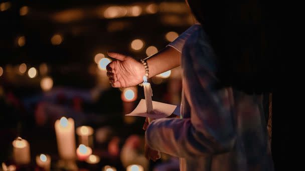 PHOTO: Mourners gather for a candlelight vigil at a makeshift memorial to the victims of the Fourth of July shooting rampage in Highland Park, Ill., July 5, 2022.  (The New York Times via Redux, FILE)
