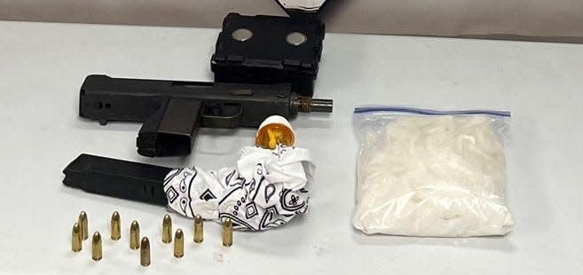 The Reno County Sheriff's Drug Enforcement Unit seized this firearm and pound of suspected meth following a traffic stop outside of Haven on Nov. 3, 2021. Two Dodge City men were arrested.