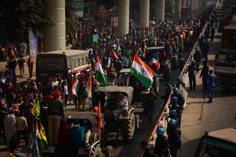 DELHI, INDIA - 2021/01/26: Farmers' Tractors Parade at the Tikri border during the demonstration. Farmers protesting against agricultural reforms breached barricades and clashed with police in the capital on the India's 72nd Republic Day. The police fired tear gas to restrain them, shortly after a convoy of tractors trundled through the Delhi's outskirts. (Photo by Manish Rajput/SOPA Images/LightRocket via Getty Images)