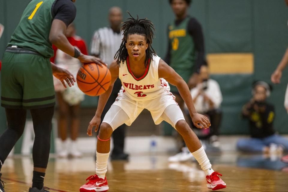 Lawrence North High School sophomore Cameron Webster (2) defends Indianapolis Crispus Attucks High School junior Chris Hurt (1) as he brings the ball up court during the first half of an IHSAA basketball game, Tuesday, Dec. 19, 2023, at Lawrence North High School.