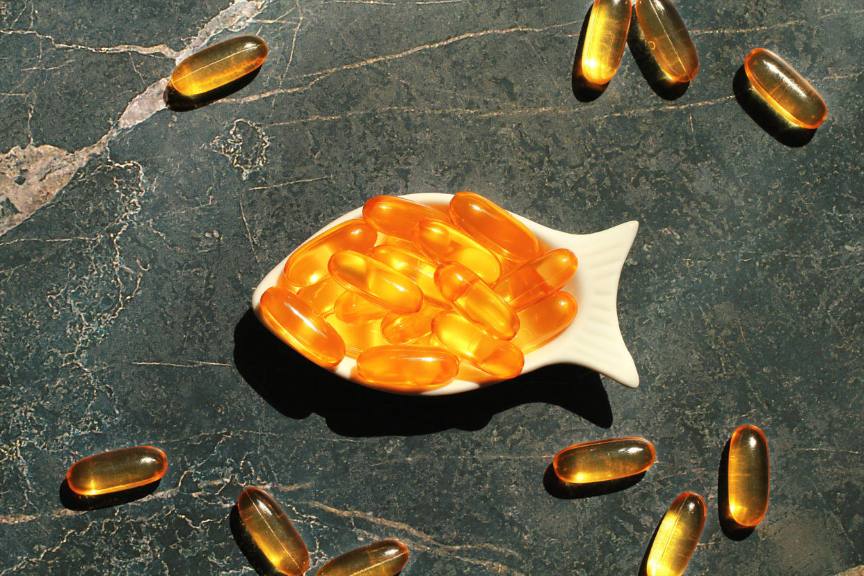 Fish Oil Capsules in Fish-Shaped Bowl Getty Images/Marina Sidorova