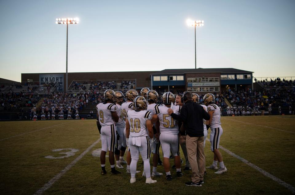The Jasper Wildcats gather with Jasper Head Coach Tony Lewis before their game against the Castle Knights at John Lidy Field Friday night, Sept. 30, 2022.