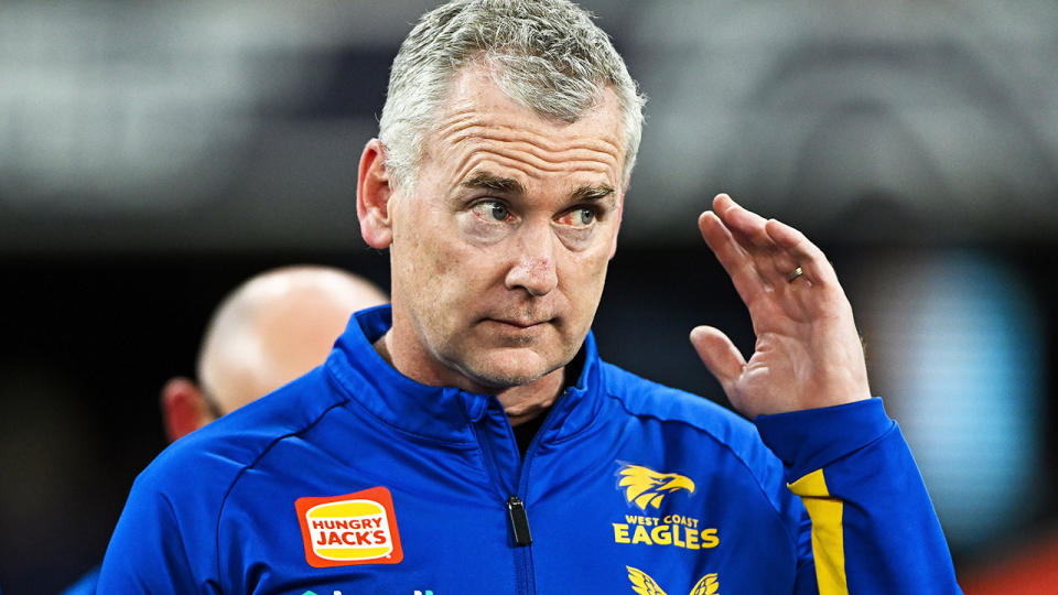 Adam Simpson gestures to a West Coast Eagles player during an AFL match.