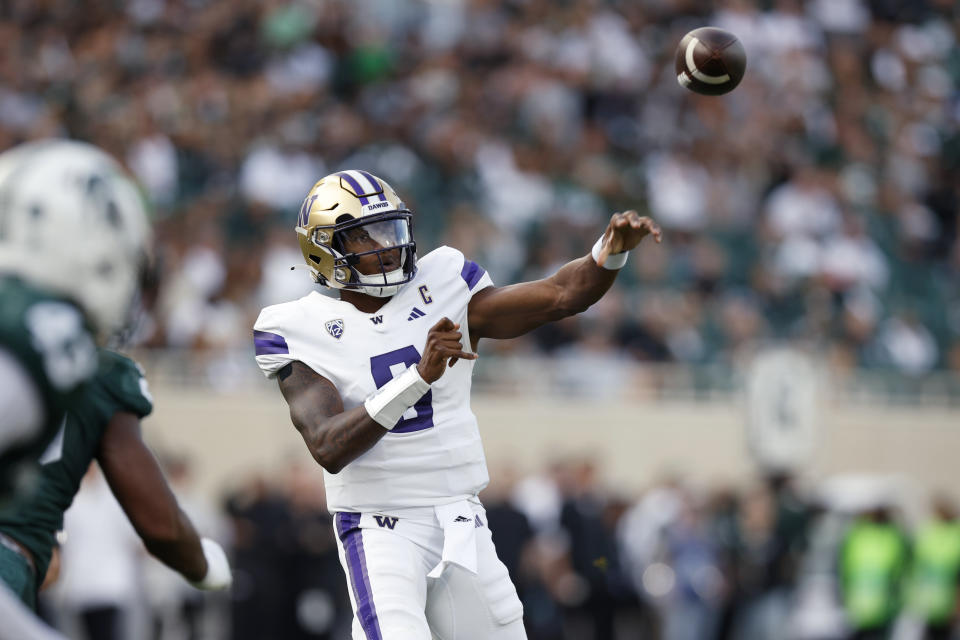 Washington's Michael Penix Jr. throws a pass against Michigan State during the first half of an NCAA college football game, Saturday, Sept. 16, 2023, in East Lansing, Mich. Washington won 41-7. (AP Photo/Al Goldis)