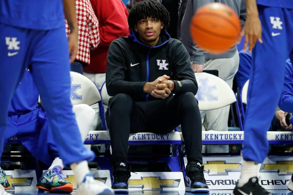 Kentucky freshman Shaedon Sharpe watches teammates warm up before a game against the Georgia Bulldogs at Rupp Arena in Lexington, Ky., Saturday, Jan. 8, 2022.