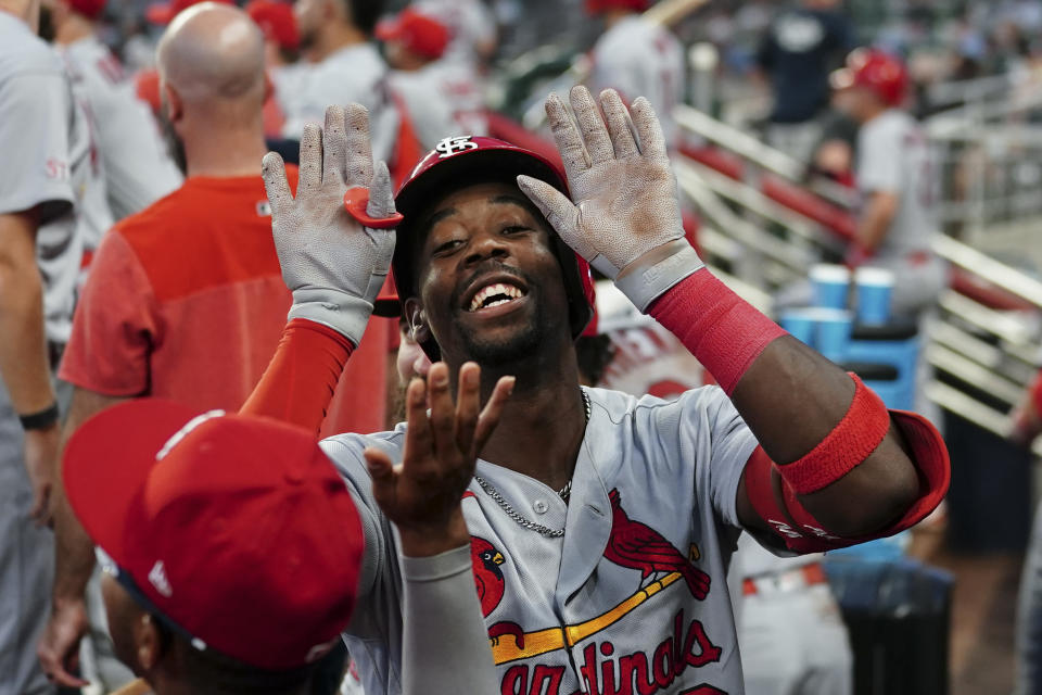 St. Louis Cardinals right fielder Jordan Walker, center, celebrates a solo home run in the fourth inning of a baseball game against the Atlanta Braves, Tuesday, Sept. 5, 2023, in Atlanta. (AP Photo/John Bazemore)