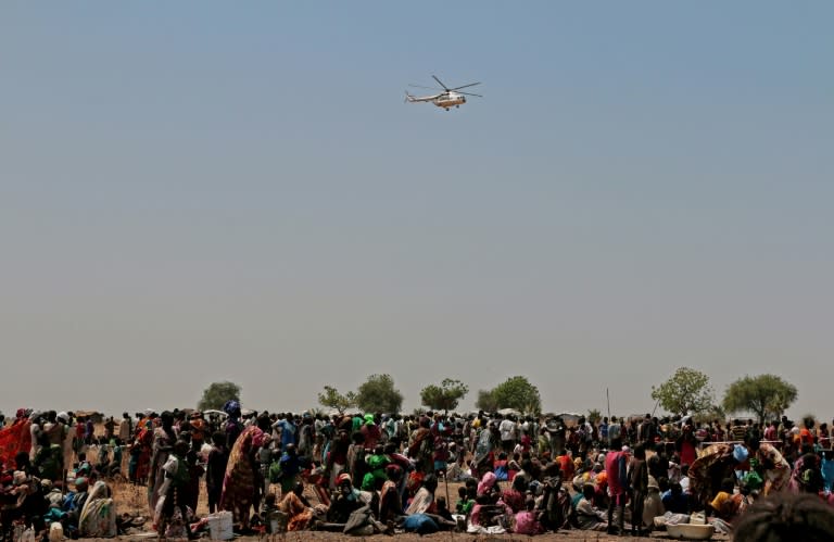 A helicopter arriving with food supplies in South Sudan, where the UN has declared a famine in several areas