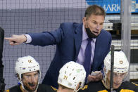 FILE - In this April 25, 2021 file photo, Boston Bruins head coach Bruce Cassidy gives instructions during the third period of an NHL hockey game against the Pittsburgh Penguins in Pittsburgh. Cassidy said the Bruins are kind of “playing themselves” in the second round against the New York Islanders because the East Division rivals have similar styles, structure and strong goaltending. (AP Photo/Gene J. Puskar, File)