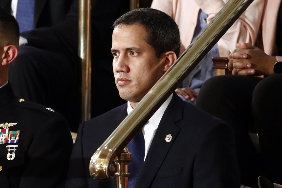 Venezuelan opposition leader Juan Guaido listens as President Donald Trump delivers his State of the Union address to a joint session of Congress on Capitol Hill in Washington, Tuesday, Feb. 4, 2020. (AP Photo/Patrick Semansky)