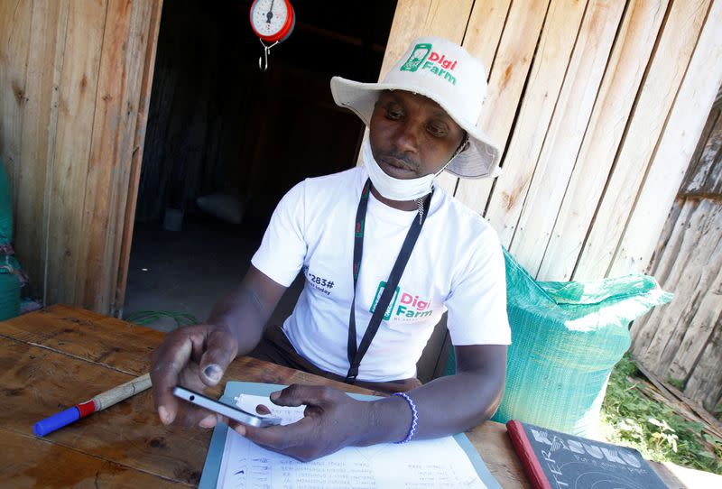 Daniel Lang'at prepares to receive farmers at the collection centre facilitated by Safaricom DigiFarm App, that helps agribusinesses and small holding farmers to share information and transact easily, in Sigor village of Bomet County