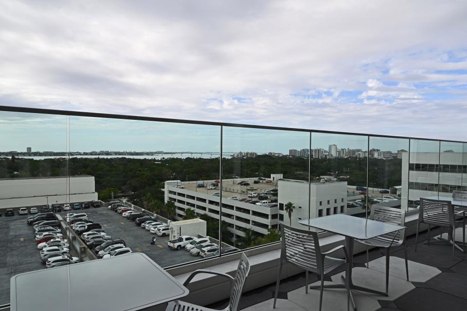 The rooftop cafe of the Brian D. Jellison Cancer Institute oncology tower includes an outdoor seating area with a panoramic view of Sarasota Bay.