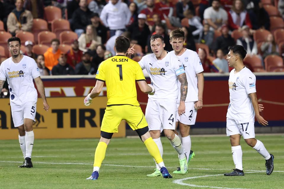 Northern Colorado Hailstorm FC goalkeeper Thomas Olsen (1) and defender Robert Cornwall (4) celebrate a win after the final whistle against Real Salt Lake at Rio Tinto Stadium April 20.