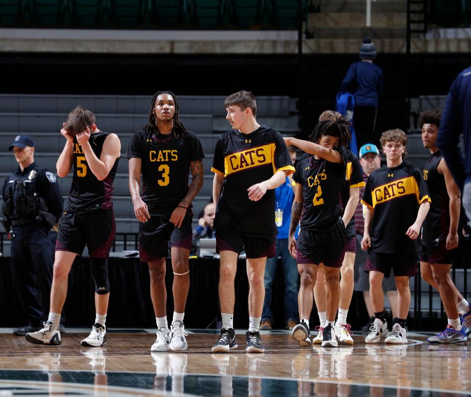 Niles Brandywine players react after their loss to Traverse City St. Francis, Thursday, March 23, 2023, in East Lansing.