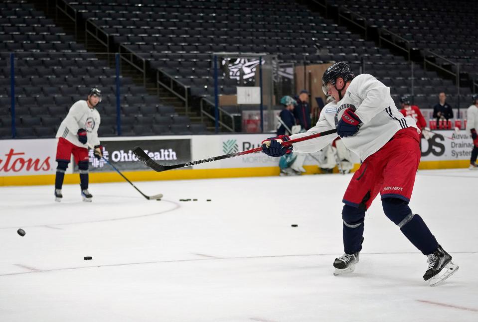 Sep 21, 2023; Columbus, Ohio, USA; Columbus Blue Jackets Patrik Laine shoots on goal while getting a pass from Adam Fantilli during training camp at Nationwide Arena.