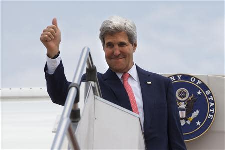 U.S. Secretary of State John Kerry makes the thumbs up sign as he leaves, after completing his trip to Malaysia, from Subang TUDM outside of Kuala Lumpur, October 11, 2013. REUTERS/Jacquelyn Martin/Pool