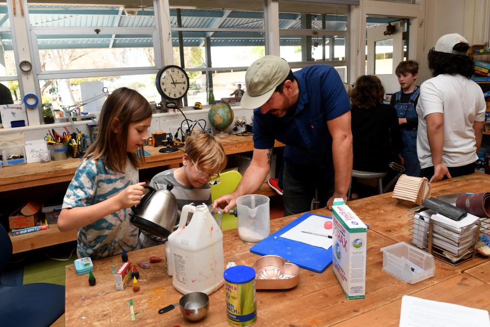 Sky Martinez, left, 9, and Eli Robisheaux, 8, make bouncy balls March 18 in the science and engineering classroom with teacher Peter Cable at the alternate school program Rock Tree Sky, which is housed at Summit School in Ojai.