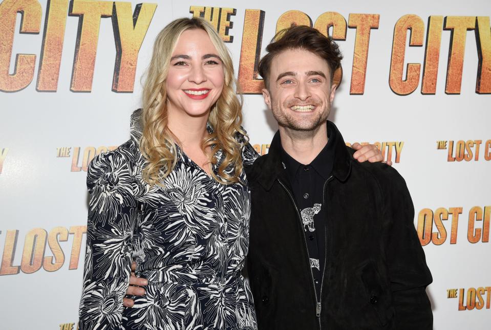 Daniel Radcliffe, right, and girlfriend Erin Darke attend a special screening of "The Lost City."