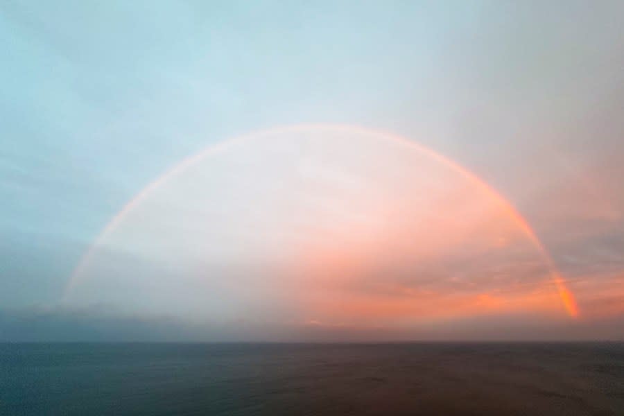 A rainbow forms over the Pacific Ocean near Black’s Beach, Thursday, Feb. 1, 2024, in San Diego. The first of two back-to-back atmospheric rivers drenched California on Thursday, flooding roads and toppling trees while triggering statewide storm preparations and calls for people to get ready for powerful downpours, heavy snow and damaging winds. (AP Photo/Denis Poroy)