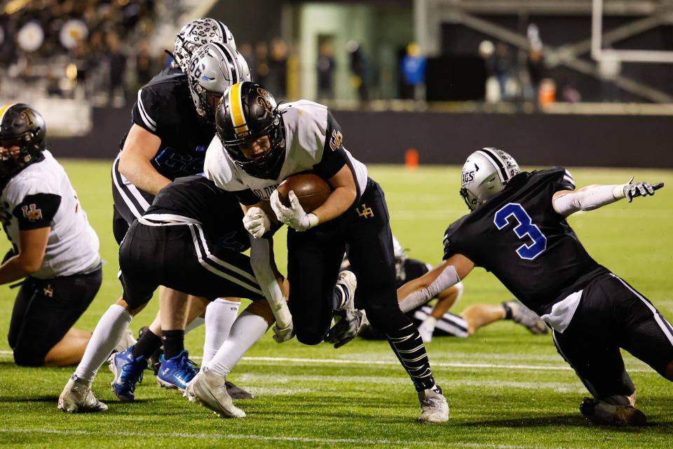 Upper Arlington’s Connor McClellan runs in for a touchdown against Hilliard Bradley on Friday night.