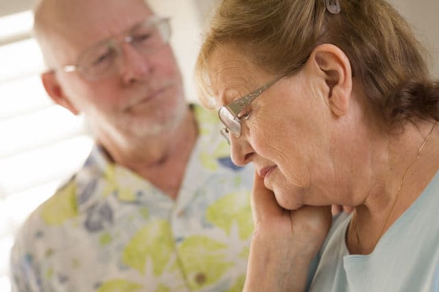 senior adult man consoles sad...