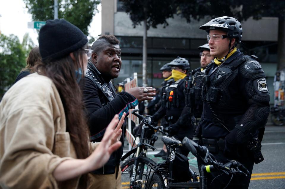 Police officers working to retake the Capitol Hill occupied protest area in Seattle last week (Reuters)