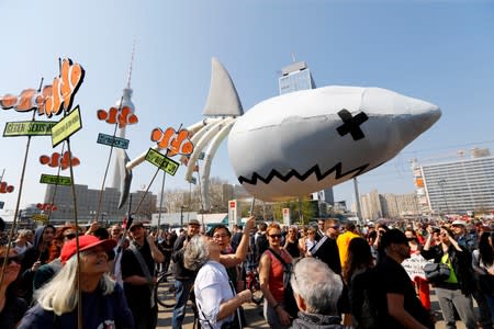 FILE PHOTO: People take part in a protest against rising rents and a housing shortage in Berlin