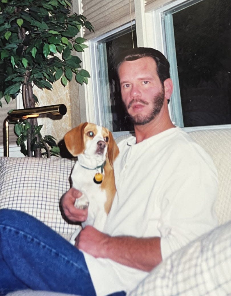 Even though Pfulb and Slaughter were both animal lovers, they only had one pet together during their long union because they traveled a lot. J.D. Pfulb holds Bea the beagle in this undated photo.