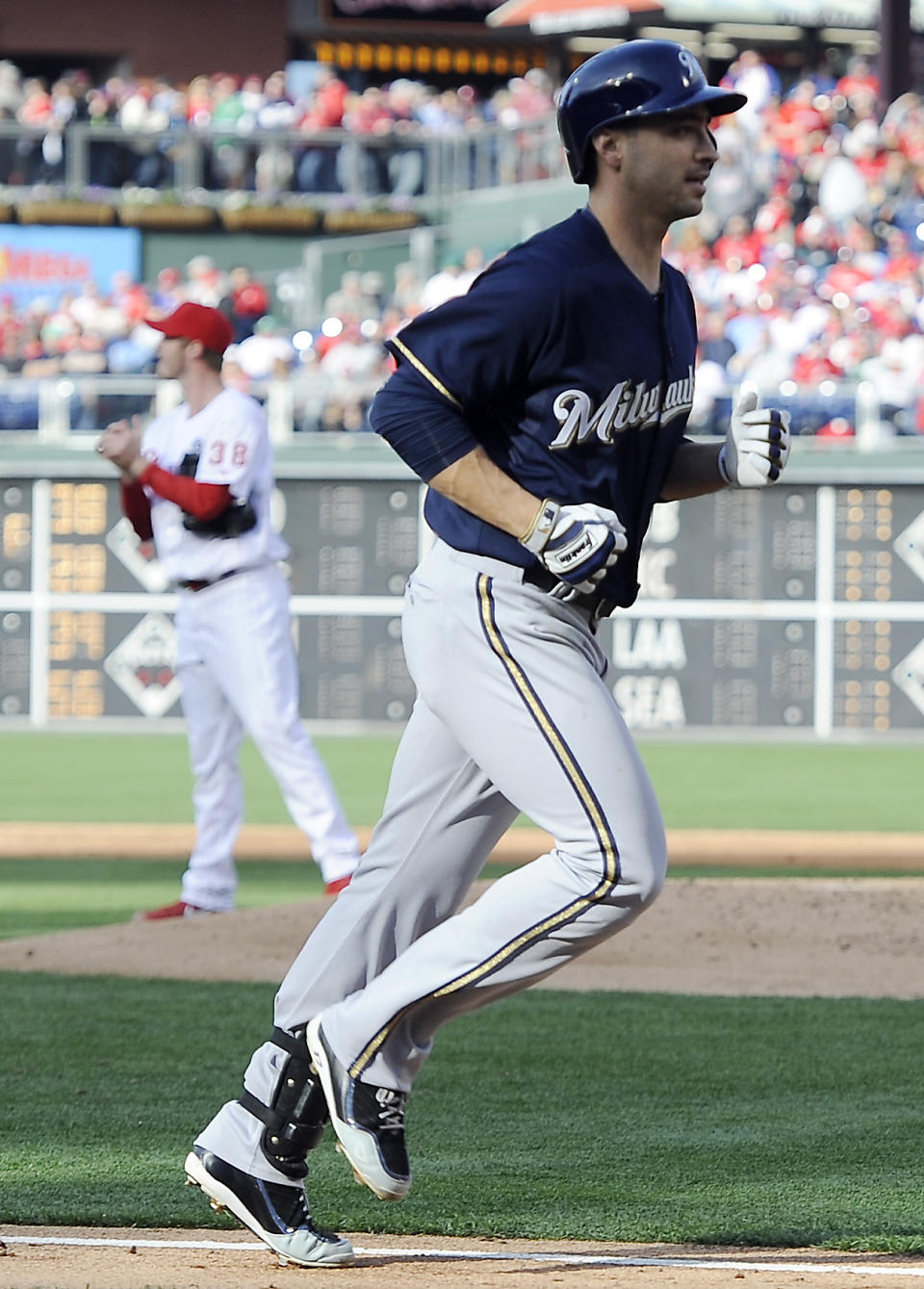 Milwaukee Brewers' Ryan Braun rounds the bases after hitting a three-run home run in the third inning of a baseball game Tuesday, April 8, 2014, in Philadelphia. (AP Photo/Michael Perez)