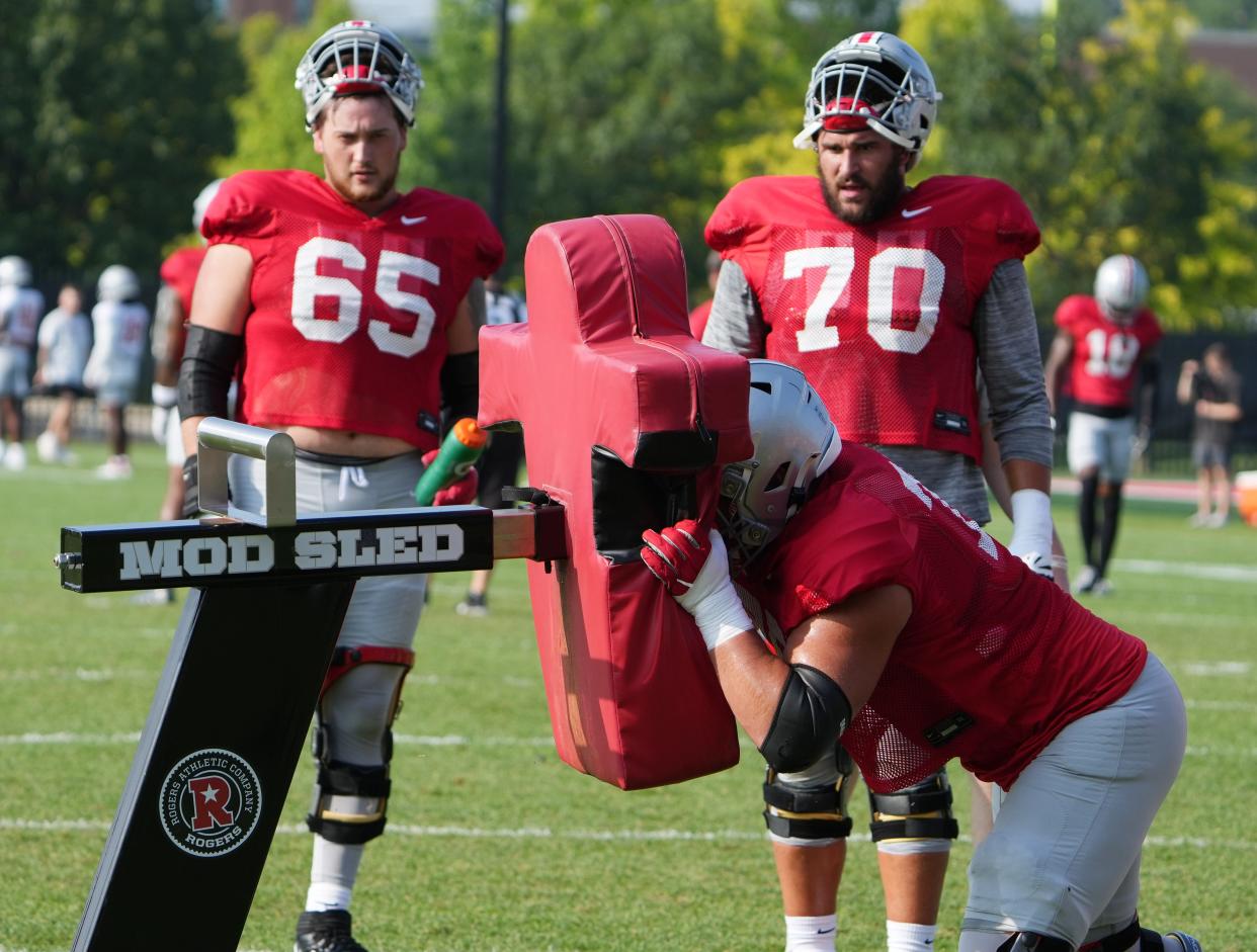 Aug 11, 2023; Columbus, OH, USA; Zen Michalski (65) and Josh Fryar (70) watch a teammate during the August 11, 2023 football practice at the Woody Hayes Athletic Center. 