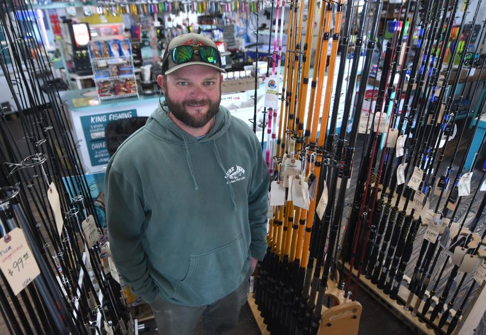 Paul Robertson stands inside the shop at Kure Beach Pier in Kure Beach, N.C., Monday, March 28, 2022. Robertson father owns the pier but he runs the business. The pier has been in the family since it was first built in 1923.