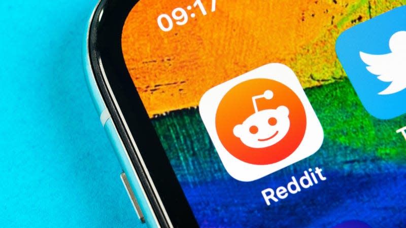 An image of the Reddit icon on an iPhone screen is shown.