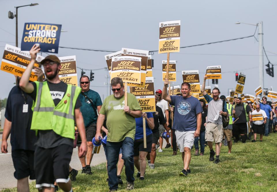 With signs that say "Just Practicing For A Just Contract," around 70 UPS workers and members of the Teamsters Local 89, which represents roughly 10,000 UPS employees in Louisville, practiced strike outside Worldport, the largest sorting and logistics facility in America Wednesday morning in Louisville, Ky. June 28, 2023
