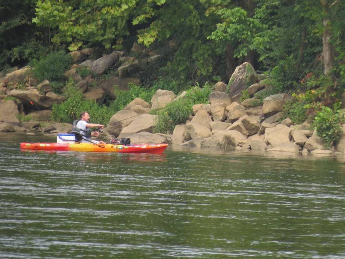 People fishing and kayaking fill the waters of the Catawba River during parts of the year.