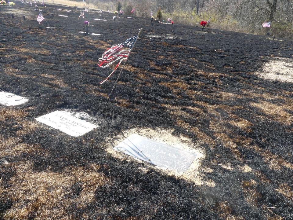 Several American flags placed at the Floral Hills Memory Gardens were damaged during the March 6 fire.