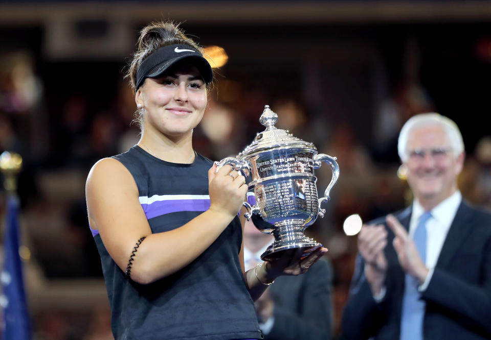 NEW YORK, NEW YORK - SEPTEMBER 07: Bianca Andreescu of Canada celebrates with the championship trophy during the trophy presentation ceremony after winning the Women's Singles final against against Serena Williams of the United States on day thirteen of the 2019 US Open at the USTA Billie Jean King National Tennis Center on September 07, 2019 in the Queens borough of New York City. (Photo by Elsa/Getty Images)