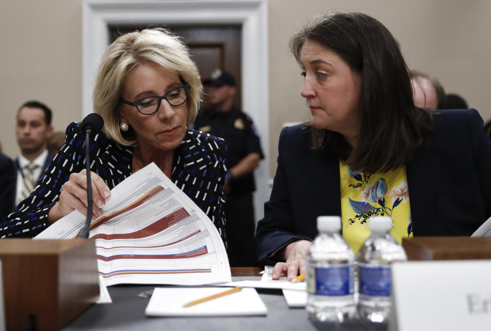 Education Secretary Betsy DeVos, left, accompanied by Education Department Budget Service Director Erica Navarro, testify at a hearing on the Education Department's fiscal 2018 budget on May 24, 2017. (Photo: Carolyn Kaster/AP)