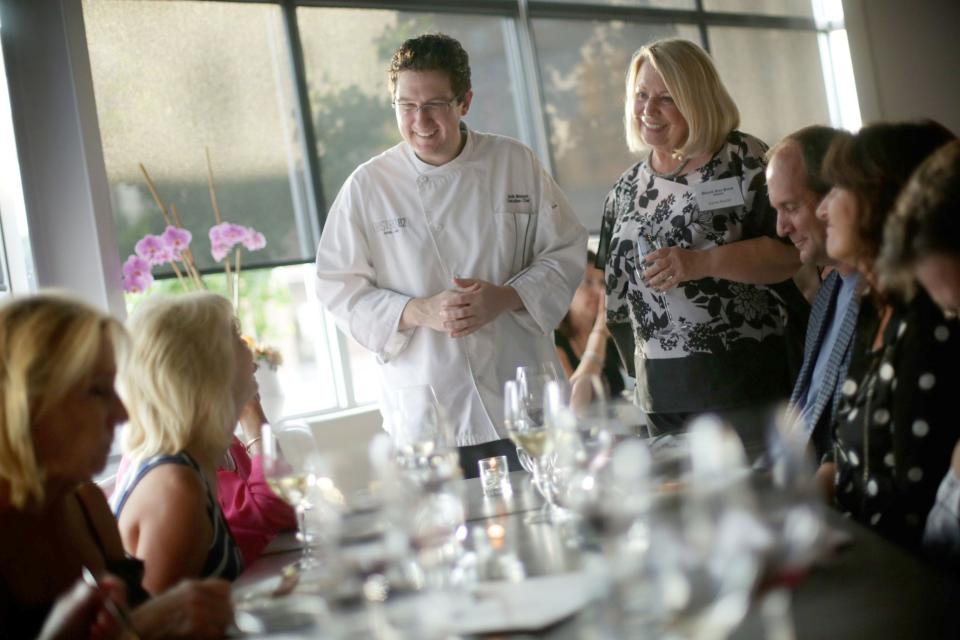Sylvia Rector, standing at right, was instrumental in developing the Detroit Free Press' Restaurant of the Year efforts. She's shown here in 2015 chatting with guests and chef Derik Watson during the Top 10 Takeover dinner series at the Bistro 82 in Royal Oak.