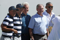 <p>Captain’s assistant Tiger Woods of the U.S. Team speaks to former U.S. President Barack Obama on the first tee during Thursday foursome matches of the Presidents Cup at Liberty National Golf Club on September 28, 2017 in Jersey City, New Jersey. (Photo by Rob Carr/Getty Images) </p>