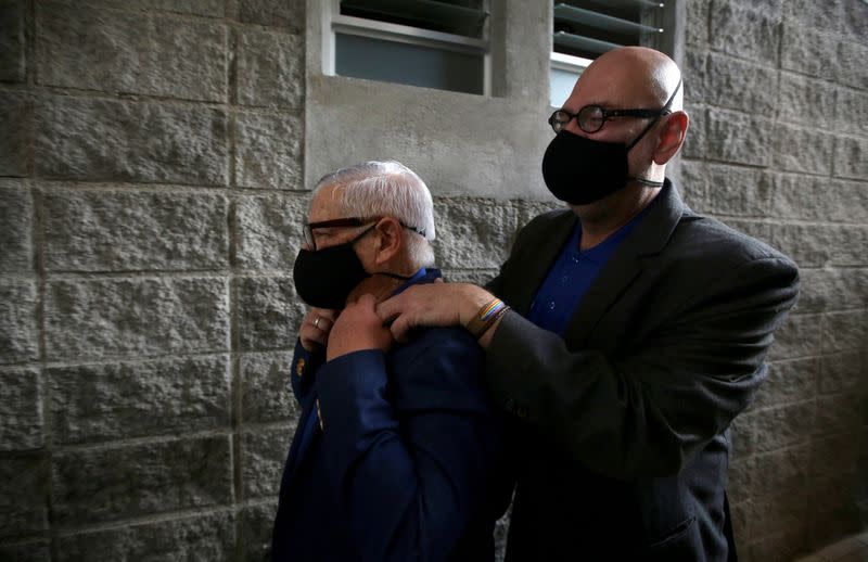 Marcos Castillo and his partner Rodrigo Campos leave a family court following their marriage ceremony, after Costa Rica legalised same-sex marriage, in San Jose