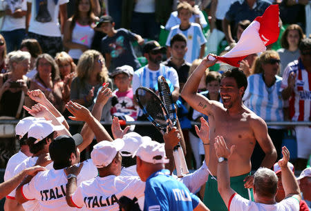 Tennis - Argentina v Italy - Davis Cup World Group First Round - Parque Sarmiento stadium, Buenos Aires, Argentina - 6/2/17. Italy's Fabio Fognini celebrates with teammates after he won his match against Argentina's Guido Pella. REUTERS/Marcos Brindicci