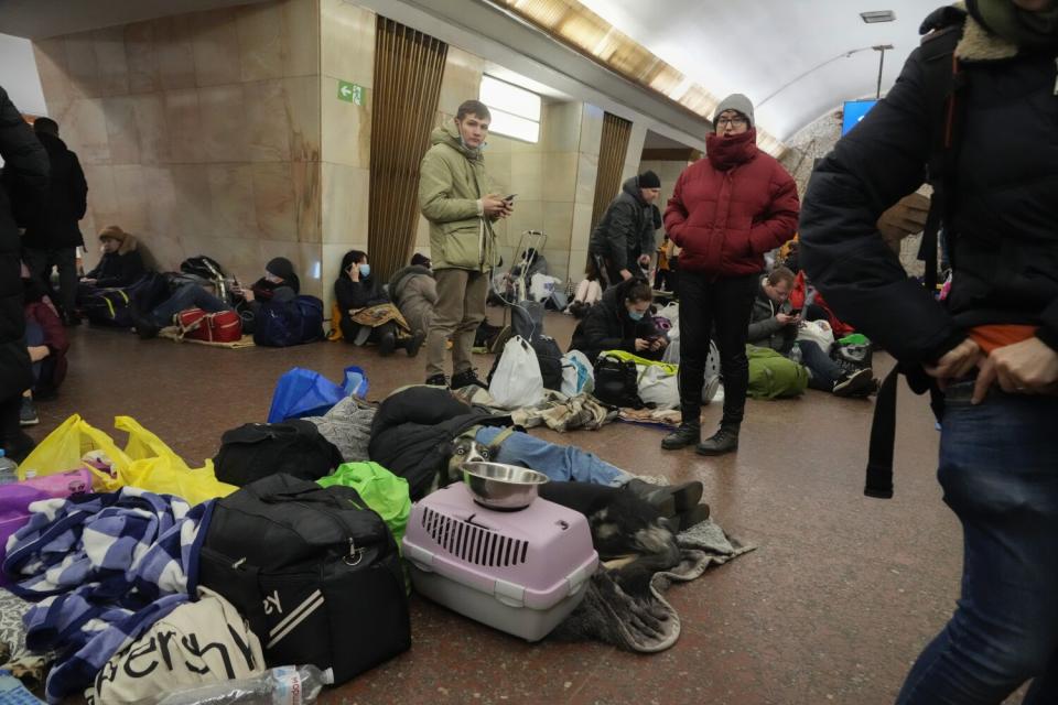Residents take shelter in a subway station in Kyiv on Feb. 25.