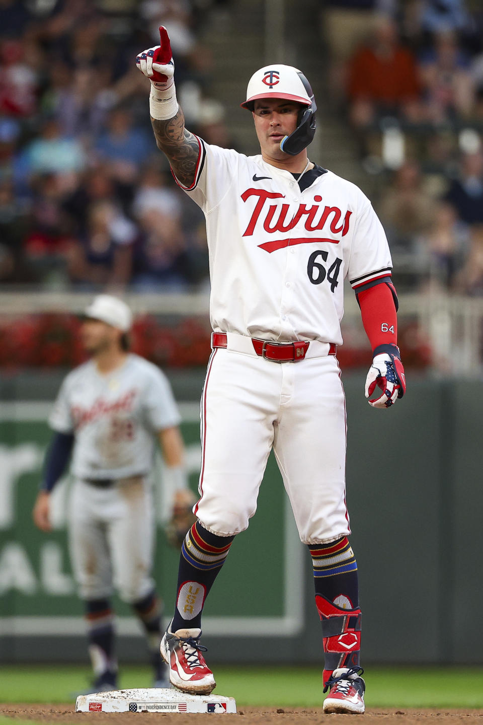 Minnesota Twins' Jose Miranda celebrates his two RBI double against the Detroit Tigers during the fourth inning of a baseball game, Thursday, July 4, 2024, in Minneapolis. (AP Photo/Matt Krohn)