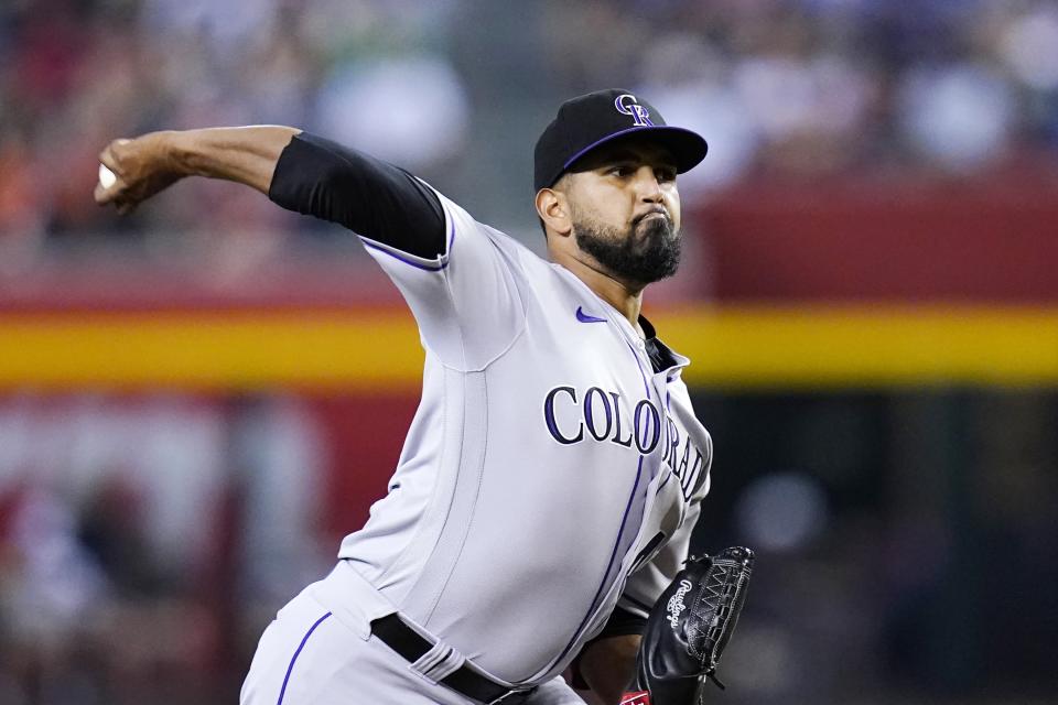 Colorado Rockies starting pitcher German Marquez throws against the Arizona Diamondbacks during the first inning of a baseball game Friday, Aug. 5, 2022, in Phoenix. (AP Photo/Ross D. Franklin)