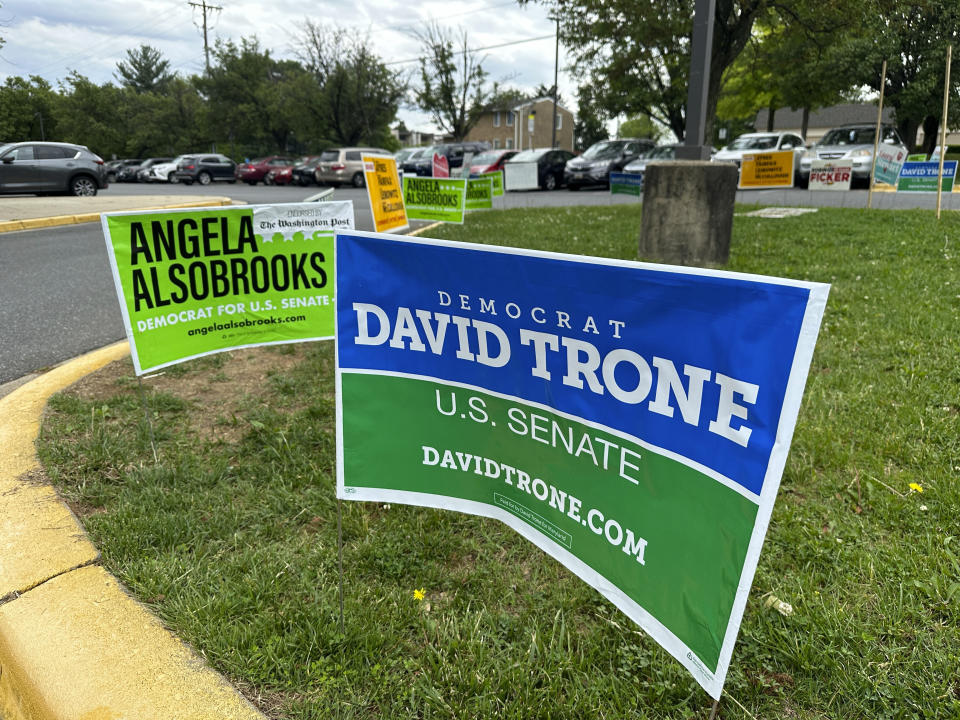 Signs are pictured outside an early voting center on Thursday, May 9, 2024, in Rockville, Md. President Joe Biden and former President Donald Trump look to pad their delegate totals in Maryland Tuesday, May 14. Maryland voters will also decide contested primaries in a Senate race that has further complicated Democratic efforts to keep control of the narrowly divided chamber this fall. The leading Democratic primary candidates are Rep. David Trone and Prince George's County Executive Angela Alsobrooks. (AP Photo/Robert Yoon)
