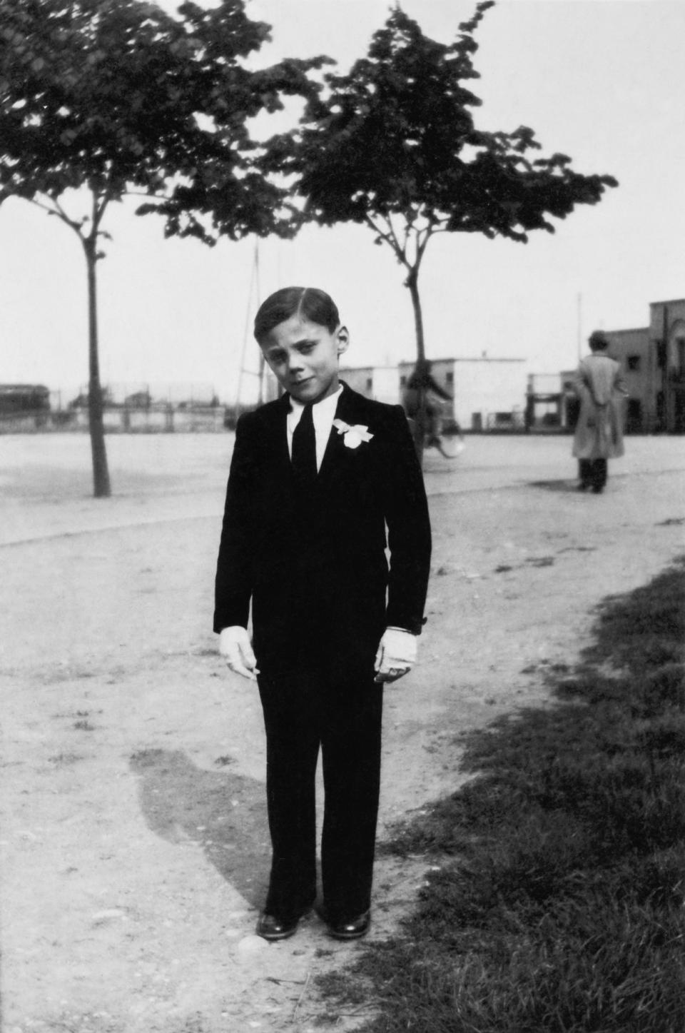 A dapper Giorgio Armani aged 8, the day of his First Communion in 1942.