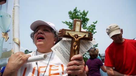 Pro-Life supporters protest outside of Planned Parenthood as a deadline looms to renew the license of Missouri's sole remaining Planned Parenthood clinic in St. Louis