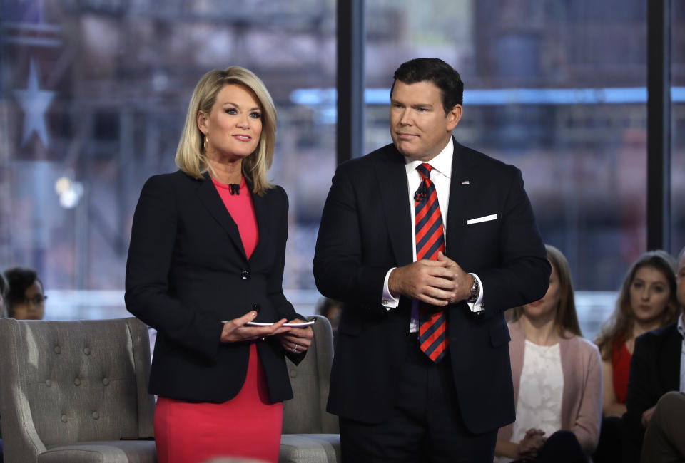 FILE - Bret Baier, right, and Martha MacCallum, left, stand during a Fox News town-hall style event, April 15, 2019 in Bethlehem, Pa. Baier and MacCallum moderated Fox News' two-hour Republican presidential debate Wednesday night. (AP Photo/Matt Rourke, File)