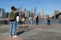 <p>People take photographs of the New York City skyline from Pier 1 at the Brooklyn Bridge Park on Sept. 4, 2017. (Photo: Gordon Donovan/Yahoo News) </p>