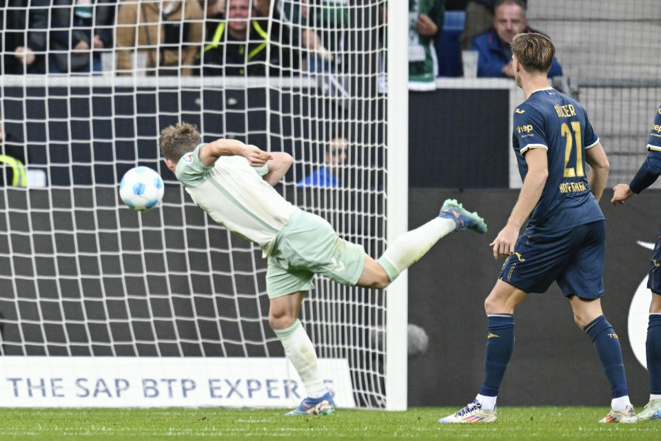 Bremen's Jens Stage scores his side's fourth goal during the Bundesliga soccer match between TSG 1899 Hoffenheim and Werder Bremen, at the PreZero Arena in Sinsheim, Germany, Sunday, Sept. 29, 2024. (Uwe Anspach/dpa via AP)